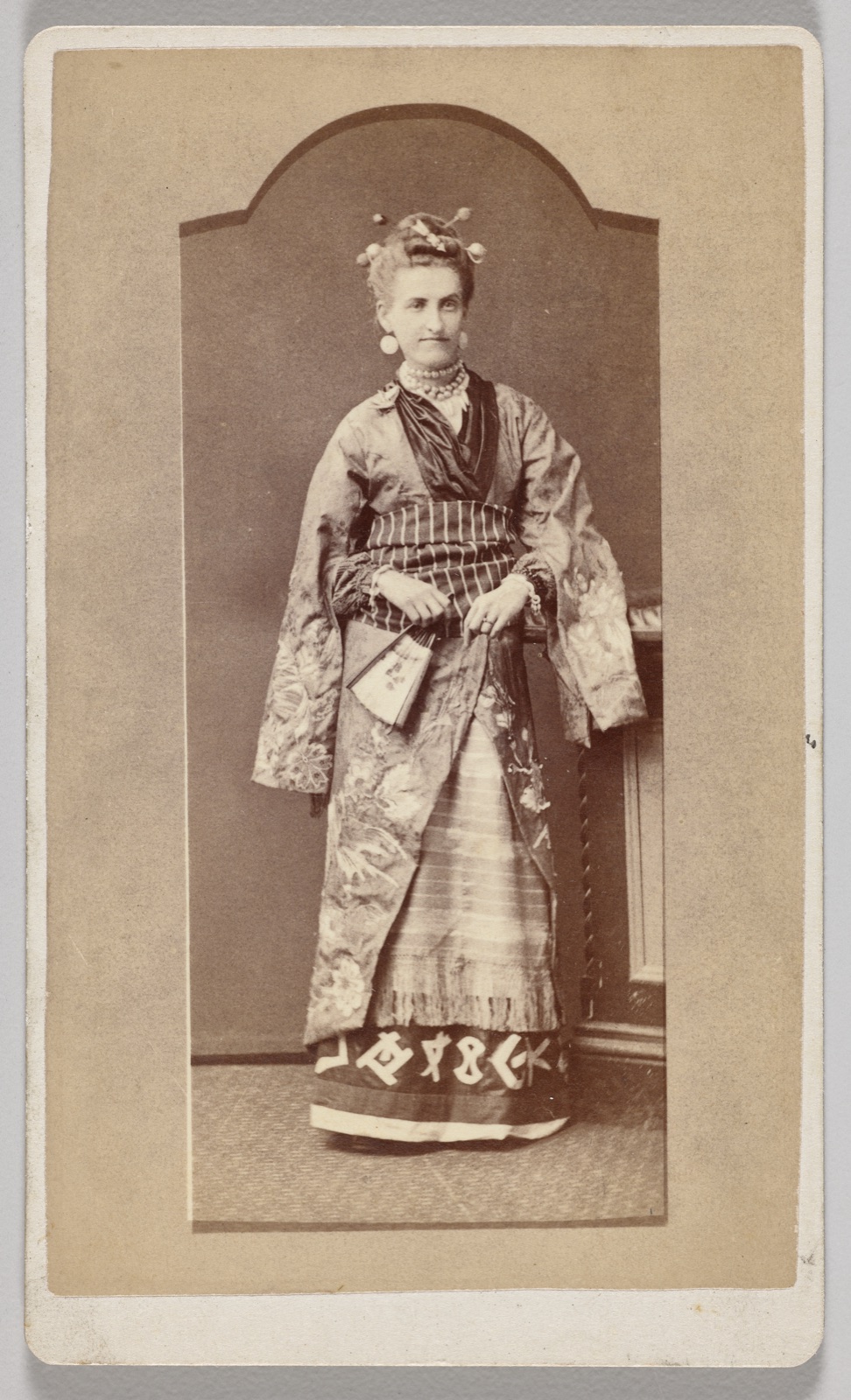 Untitled (white woman in Japanese kimono with fan)