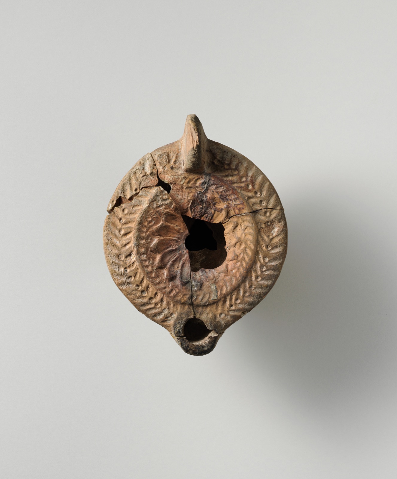 Terracotta oil lamp