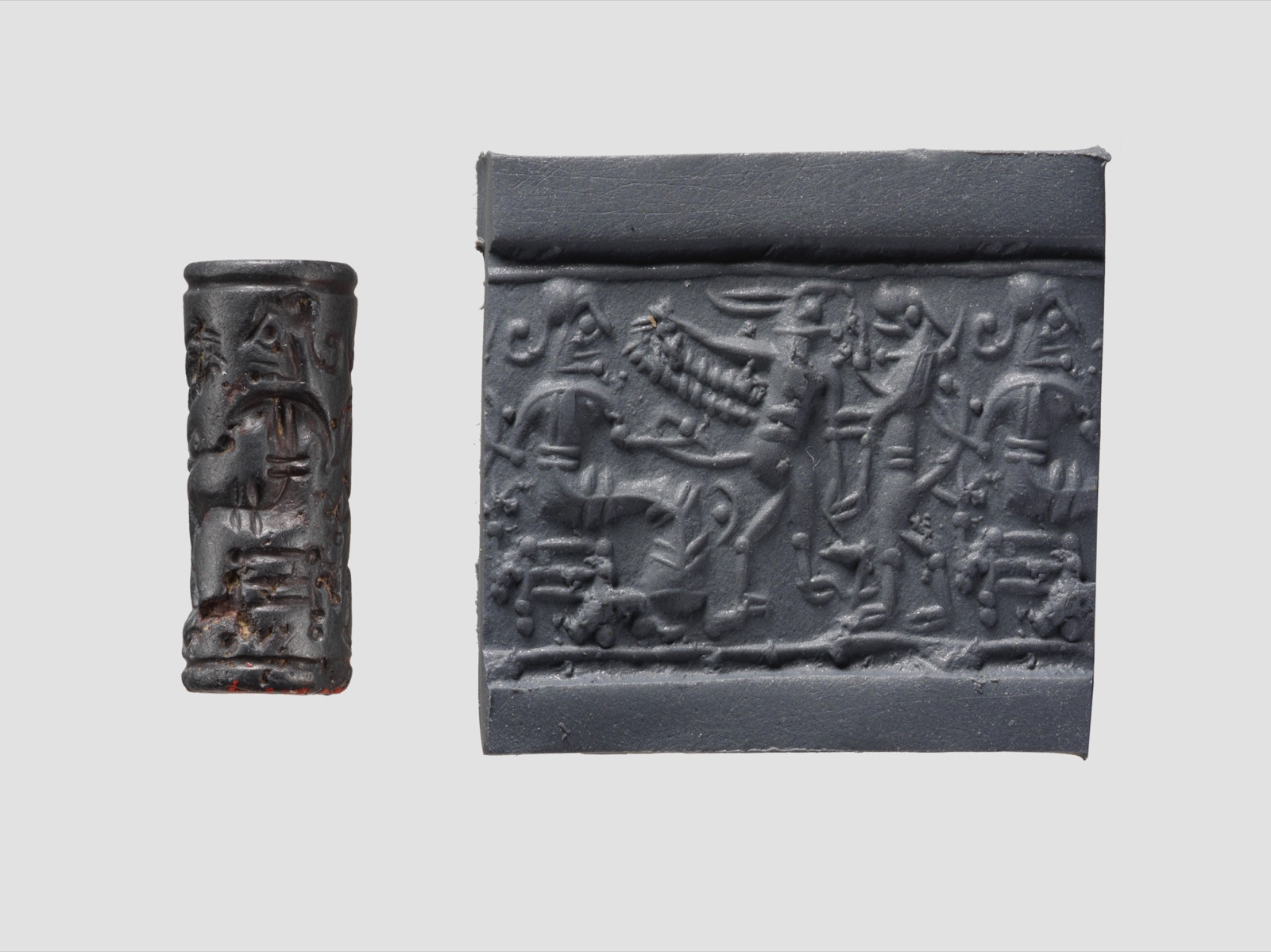 Cylinder seal and modern impression: confronted upright lion and griffin before a seated figure