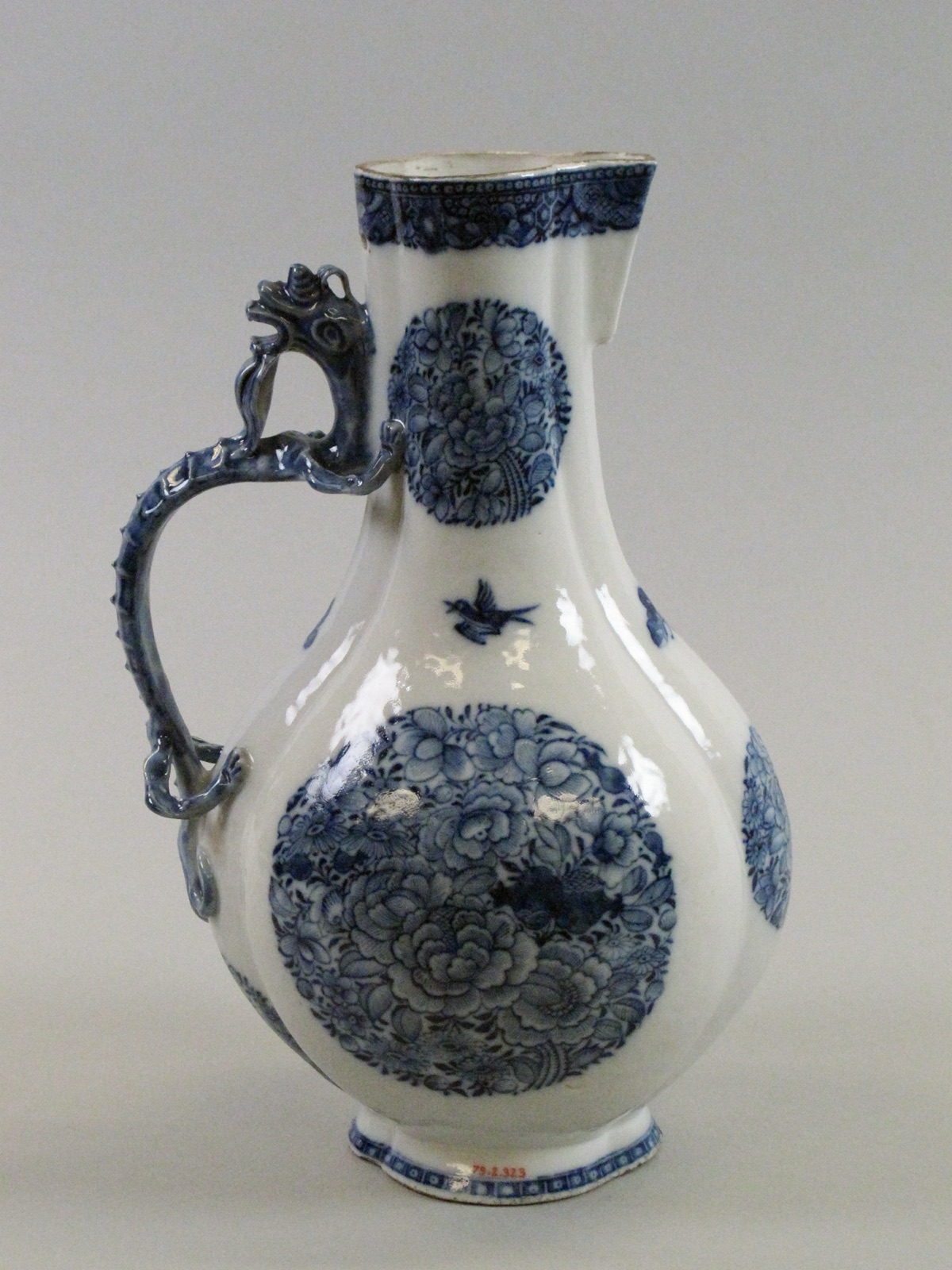 Jug with dragon handle and floral madellions