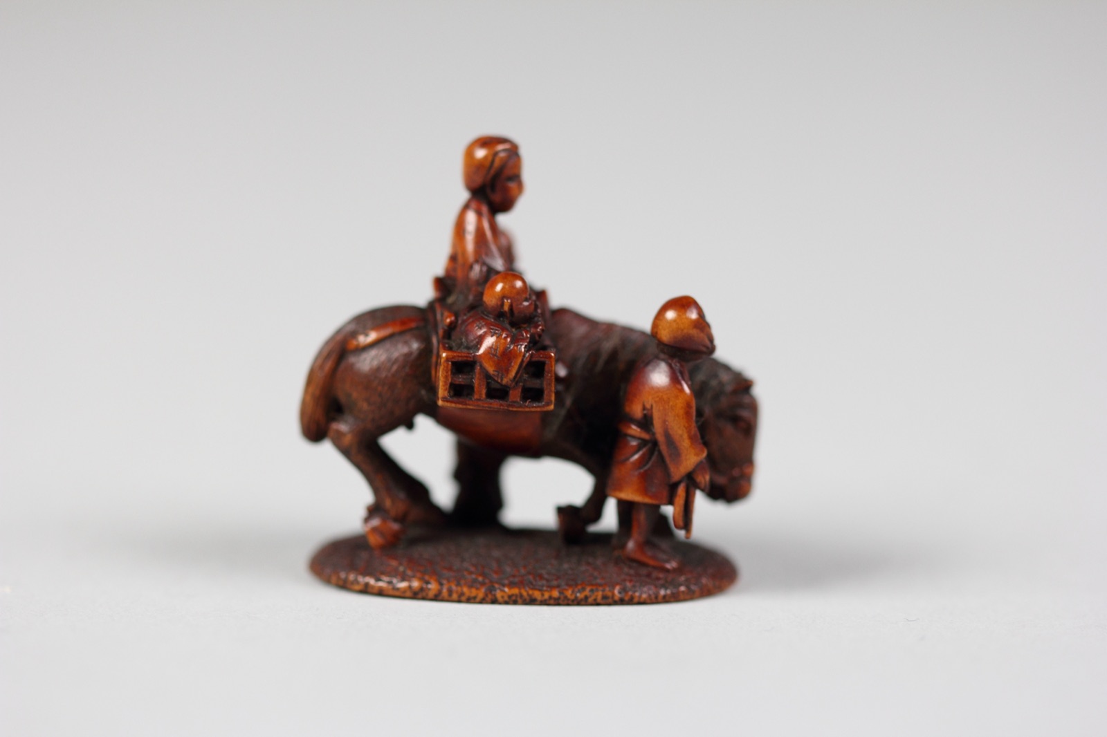 Netsuke of Figures with Horse