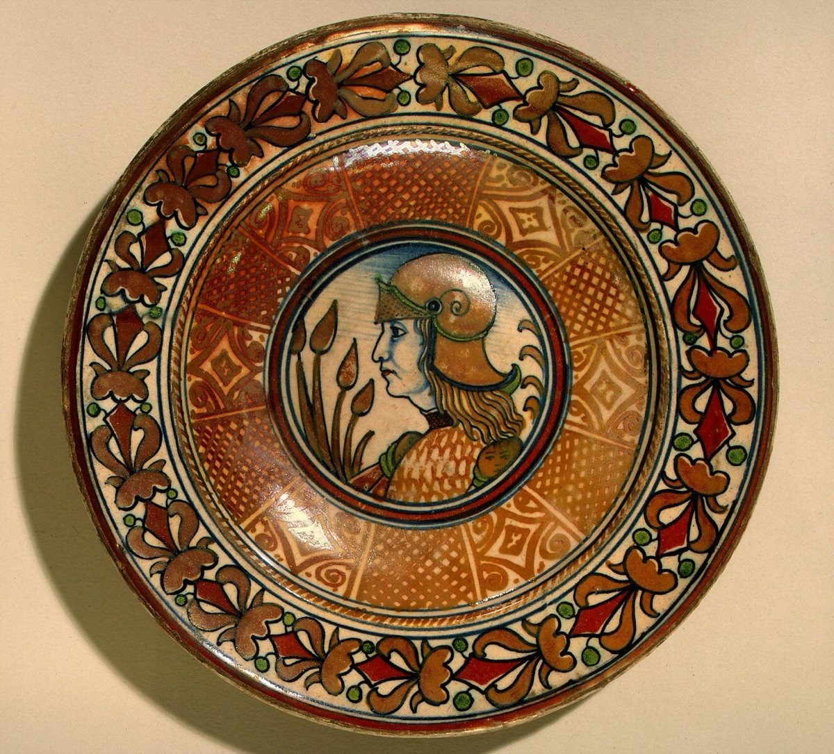 Plate with running plant border and geometric panels on well; in the center, profile bust of a man in armor — Deruta 16th Century; Gubbio 16th Century; Deruta or Possibly Gubbio 16th Century