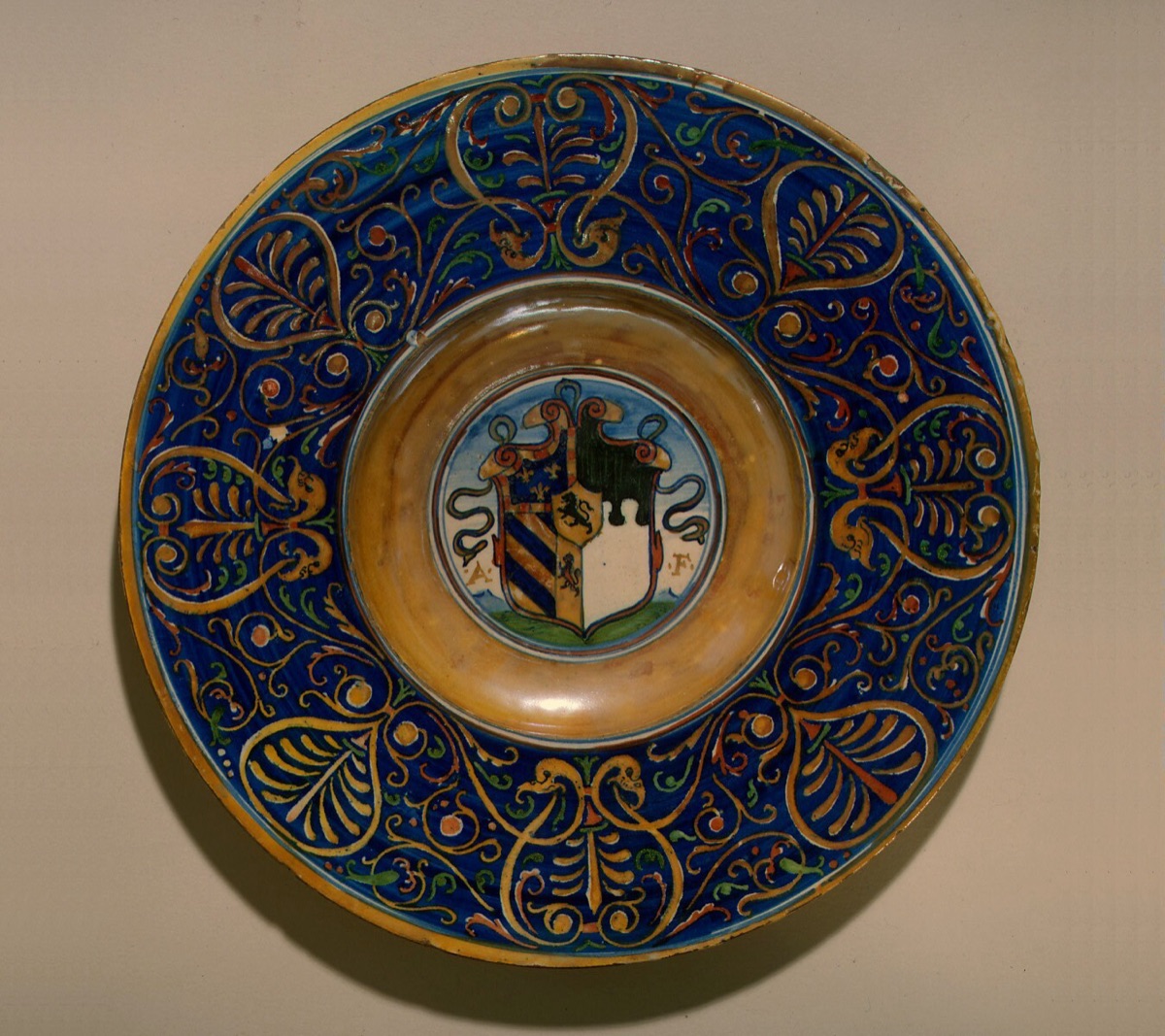 Plate with border of palmettes and scrollwork; in the center, a shield of arms and the initials A.F. — related artist: Maestro Giorgio Andreoli of Gubbio; Italian 16th Century; Workshop of Maestro Giorgio Andreoli of Gubbio